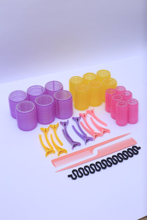 Hair Curlers Heated Rollers in Use – A woman using heated hair curlers to achieve smooth, salon-quality curls at home.
